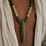 Close up of green ceramic spear pendant necklace for men